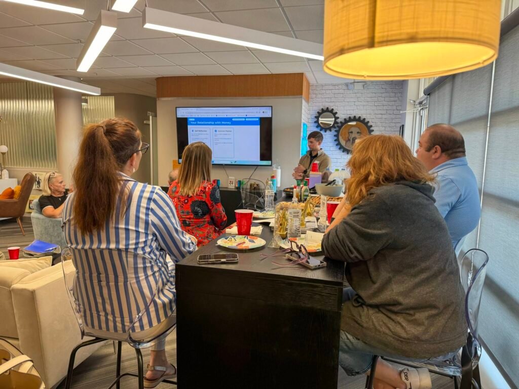 Attendees discussing a business topic at a lunch-and-learn event
